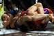 March 3, 2012; Columbus, OH, USA; Ronda Rousey gets Miesha Tate in an armbar during the Strikeforce Grand Prix final at Nationwide Arena. Mandatory Credit: Greg Bartram-USA TODAY Sports
