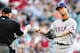 HOUSTON - MAY 11: Yu Darvish #11 of the Texas Rangers hands the ball to home plate umpire Jeff Kellogg #8 at Minute Maid Park on May 11, 2013 in Houston, Texas. (Photo by Bob Levey/Getty Images)