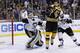 Jun 5, 2013; Boston, MA, USA; Boston Bruins center Chris Kelly (23) narrowly deflects the puck towards Pittsburgh Penguins goalie Tomas Vokoun (92) while being pushed by center Joe Vitale (46) during the first overtime period in game three of the Eastern Conference finals of the 2013 Stanley Cup Playoffs at TD Garden. Mandatory Credit: Greg M. Cooper-USA TODAY Sports