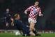 GLASGOW, UNITED KINGDOM - MARCH 26: Igor Budan of Croatia is tackled by James McEveley of Scotland during the Tennent's International Challenge friendly match between Scotland and Croatia at Hampden Park on March 26, 2008 in Glasgow, Scotland. (Photo by Stu Forster/Getty Images)