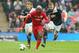 Liverpool and Everton are both eyeing Wigan striker Arouna Kone.