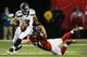 ATLANTA, GA - JANUARY 13: Russell Wilson #3 of the Seattle Seahawks tries to avoid the tackle of Kroy Biermann #71 of the Atlanta Falcons during the NFC Divisional Playoff Game at Georgia Dome on January 13, 2013 in Atlanta, Georgia. (Photo by Kevin C. Cox/Getty Images)