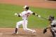 BALTIMORE, MD - JUNE 2: Nate McLouth #9 of the Baltimore Orioles hits an RBI single in the seventh inning during a baseball game against the Detroit Tigers on June 2, 2013 at Oriole Park at Camden Yards in Baltimore, Maryland. The Orioles won 4-2. (Photo by Mitchell Layton/Getty Images)