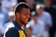PARIS, FRANCE - JUNE 04: Jo-Wilfried Tsonga of smiles after victory in his Men's Singles quarter final match against Roger Federer of Switzerland during day ten of the French Open at Roland Garros on June 4, 2013 in Paris, France. (Photo by Matthew Stockman/Getty Images)