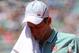 PARIS, FRANCE - JUNE 07: Novak Djokovic of Serbia wipes his face with a towel during the men's singles semi-final match against Rafael Nadal of Spain on day thirteen of the French Open at Roland Garros on June 7, 2013 in Paris, France. (Photo by Julian Finney/Getty Images)