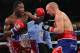 Feb 16, 2013; Atlantic City, NJ, USA; Adrien Broner (Red trunks) and Gavin Rees (Blue/Red trunks) trade punches during their 12 round WBC Lightweight Championship bout at Boardwalk Hall. Mandatory Credit: Ed Mulholland-USA TODAY Sports