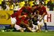 KINGSTON, JAMAICA - JUNE 07: Teammates pile onto Brad Evans #6 after scoring the game winning goal to beat Jamaica 2-1 during the FIFA 2014 World Cup Qualifier at National Stadium on June 7, 2013 in Kingston, Jamaica. (Photo by Streeter Lecka/Getty Images)