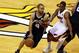 Jun 9, 2013; Miami, FL, USA; San Antonio Spurs point guard Tony Parker (9) dribbles around the defense by Miami Heat point guard Mario Chalmers (15) in the first quarter during game two of the 2013 NBA Finals at the American Airlines Arena. Mandatory Credit: Robert Mayer-USA TODAY Sports