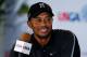 ARDMORE, PA - JUNE 11: Tiger Woods of the United States smiles while talking with the media during a press conference before a practice round prior to the start of the 113th U.S. Open at Merion Golf Club on June 11, 2013 in Ardmore, Pennsylvania. (Photo by Scott Halleran/Getty Images)