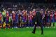 BARCELONA, SPAIN - MAY 19: Head coach Tito Vilanova walks past his players during the celebration after winning the Spanish League after the La Liga match between FC Barcelona and Real Valladolid CF at Camp Nou on May 19, 2013 in Barcelona, Spain. (Photo by David Ramos/Getty Images)