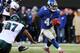 EAST RUTHERFORD, NJ - DECEMBER 30: Ahmad Bradshaw #44 of the New York Giants carries the ball and avoids Cullen Jenkins #97 of the Philadelphia Eagles at MetLife Stadium on December 30, 2012 in East Rutherford, New Jersey. The New York Giants defeated the Philadelphia Eagles 42-7. (Photo by Elsa/Getty Images)