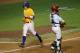 Jun 2, 2013; Baton Rouge, LA, USA; LSU Tigers infielder Mason Katz (8) scores a run on a walk in the fifth inning against the Louisiana-Lafayette Ragin Cajuns during the Baton Rouge regional of the 2013 NCAA baseball tournament at Alex Box Stadium. Mandatory Credit: Crystal LoGiudice-USA TODAY Sports