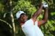ARDMORE, PA - JUNE 12: Tiger Woods of the United States hits a tee shot during a practice round prior to the start of the 113th U.S. Open at Merion Golf Club on June 12, 2013 in Ardmore, Pennsylvania. (Photo by Andrew Redington/Getty Images)