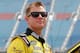 JOLIET, IL - JULY 21: Jason Leffler, driver of the #18 Dollar General/M&M's Toyota, stands on the grid during qualifying for the NASCAR Camping World Truck Series American Ethanol 225 at Chicagoland Speedway on July 21, 2012 in Joliet, Illinois. (Photo by Tyler Barrick/Getty Images for NASCAR)