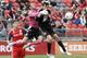 TORONTO, CANADA - OCTOBER 6: Milos Kocic #30 of Toronto FC makes the save around Chris Pontius #13 of DC United during MLS action at BMO Field October 6, 2012 in Toronto, Ontario, Canada. (Photo by Abelimages/Getty Images)