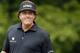 ARDMORE, PA - JUNE 13: Phil Mickelson of the United States smiles after hitting his tee shot on the 11th hole during Round One of the 113th U.S. Open at Merion Golf Club on June 13, 2013 in Ardmore, Pennsylvania. (Photo by Rob Carr/Getty Images)