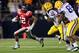 OXFORD, MS - NOVEMBER 19: Donte Moncrief #12 of the Ole Miss Rebels runs with the ball against Tahj Jones #58 and Lavar Edwards #89 of the LSU Tigers on November 19, 2011 at Vaught-Hemingway Stadium in Oxford, Mississippi. LSU beat Mississippi 52-3. (Photo by Joe Murphy/Getty Images)