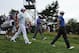 Jun 13, 2013; Ardmore, PA, USA; Rory McIlroy (left), Tiger Woods (center), and Adam Scott (right) leave the 4th tee during the first round of the 113th U.S. Open golf tournament at Merion Golf Club. Mandatory Credit: Eileen Blass-USA TODAY