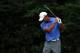ARDMORE, PA - JUNE 13: Tiger Woods of the United States reacts to his tee shot on the 11th hole during Round One of the 113th U.S. Open at Merion Golf Club on June 13, 2013 in Ardmore, Pennsylvania. (Photo by Andrew Redington/Getty Images)