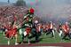 Jan 1, 2013; Pasadena, CA, USA; Stanford Cardinal tree mascot and marching band runs off the field before the 2013 Rose Bowl game against the Wisconsin Badgers at the Rose Bowl. Mandatory Credit: Robert Hanashiro-USA TODAY Sports