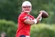 Jun 12, 2013; Foxborough, MA, USA; New England Patriots quarterback Tim Tebow passes the ball during minicamp at the practice fields of Gillette Stadium. Mandatory Credit: Stew Milne-USA TODAY Sports
