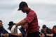 Tiger Woods tweaked his wrist or elbow at the U.S. Open