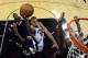 SAN ANTONIO, TX - JUNE 13: Tim Duncan #21 of the San Antonio Spurs goes up for a shot against the Miami Heat in the second half during Game Four of the 2013 NBA Finals at the AT&T Center on June 13, 2013 in San Antonio, Texas. NOTE TO USER: User expressly acknowledges and agrees that, by downloading and or using this photograph, User is consenting to the terms and conditions of the Getty Images License Agreement. (Photo by Derick E. Hingle/Pool/Getty Images)
