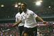Mido celebrates scoring one of two goals against Portsmouth on his Tottenham debut in February 2005.
