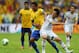 BRASILIA, BRAZIL - JUNE 15: Paulinho of Brazil tangles with Yasuhito Endo of Japan during the FIFA Confederations Cup Brazil 2013 Group A match between Brazil and Japan at National Stadium on June 15, 2013 in Brasilia, Brazil. (Photo by Clive Rose/Getty Images)