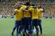 BRASILIA, BRAZIL - JUNE 15: Daniel Alves of Brazil celebrates after Neymar scored his team's opening goal during the FIFA Confederations Cup Brazil 2013 Group A match between Brazil and Japan at National Stadium on June 15, 2013 in Brasilia, Brazil. (Photo by Dean Mouhtaropoulos/Getty Images)