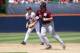 Jun 8, 2013; Charlottesville, VA, USA; Mississippi State Bulldogs 1st baseman Wes Rea (35) prepares to run to third base in front of Virginia Cavaliers infielder Nick Howard (33) inning during the Charlottesville super regional of the 2013 NCAA baseball tournament at Davenport Field. Mandatory Credit: Geoff Burke-USA TODAY Sports