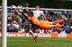 LONDON, ENGLAND - MAY 19: Simon Mignolet, Goalkeeper of Sunderland saces at the feet of Gareth Bale of Tottenham during the Barclays Premier League match between Tottenham Hotspur and Sunderland at White Hart Lane on May 19, 2013 in London, England. (Photo by Jan Kruger/Getty Images)