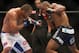 Jun 15, 2013; Winnipeg, MB, Canada; Rashad Evans (right) fights Dan Henderson during their light heavyweight bout at UFC 161 at MTS Centre. Mandatory Credit: Tom Szczerbowski-USA TODAY Sports