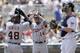 Hunter and Jackson (14) took two of three from Mauer, in white, and the Twins, creating further separation in the AL Central.