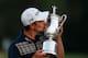 ARDMORE, PA - JUNE 16: Justin Rose of England kisses the U.S. Open trophy after winning the 113th U.S. Open at Merion Golf Club on June 16, 2013 in Ardmore, Pennsylvania. (Photo by Scott Halleran/Getty Images)