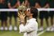 LONDON, ENGLAND - JULY 08: Roger Federer of Switzerland kisses the winner's trophy after winning his Gentlemen's Singles final match against Andy Murray of Great Britain on day thirteen of the Wimbledon Lawn Tennis Championships at the All England Lawn Tennis and Croquet Club on July 8, 2012 in London, England. (Photo by Julian Finney/Getty Images)