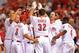 CINCINNATI, OH - JUNE 14: Jay Bruce #32 of the Cincinnati Reds is mobbed as he crosses home plate after hitting a tenth-inning walk-off home run to defeat the Milwaukee Brewers 4-3 at Great American Ball Park on June 14, 2013 in Cincinnati, Ohio. (Photo by Jamie Sabau/Getty Images)