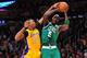 February 20, 2013; Los Angeles, CA, USA; Boston Celtics power forward Kevin Garnett (5) is fouled by Los Angeles Lakers center Dwight Howard (12) during the first half at Staples Center. Mandatory Credit: Gary A. Vasquez-USA TODAY Sports
