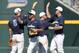 Jun 18, 2013; Omaha, NE, USA; North Carolina Tarheels players congratulate each other after defeating the LSU Tigers during the College World Series at TD Ameritrade Park. North Carolina won 4-2. Mandatory Credit: Bruce Thorson-USA TODAY Sports
