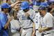 Jun 16, 2013; Omaha, NE, USA; UCLA Bruins runner Christoph Bono (3) celebrates with teammates after scoring a run against the LSU Tigers during the College World Series at TD Ameritrade Park. UCLA won 2-1. Mandatory Credit: Bruce Thorson-USA TODAY Sports