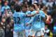 MANCHESTER, ENGLAND - APRIL 27: Sergio Aguero of Manchester City celebrates his opening goal with Carlos Tevez and David Silva during the Barclays Premier League match between Manchester City and West Ham United at the Etihad Stadium on April 27, 2013 in Manchester, England. (Photo by Alex Livesey/Getty Images)