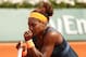 PARIS, FRANCE - JUNE 08: Serena Williams of United States of America celebrates a point in her Women's Singles Final match against Maria Sharapova of Russia during day fourteen of French Open at Roland Garros on June 8, 2013 in Paris, France. (Photo by Matthew Stockman/Getty Images)