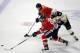 Jun 15, 2013; Chicago, IL, USA; Boston Bruins center David Krejci (46) chases the puck between Chicago Blackhawks right wing Marian Hossa (81) and defenseman Duncan Keith (2) during the overtime period in game two of the 2013 Stanley Cup Final at the United Center. Mandatory Credit: Scott Stewart-USA TODAY Sports