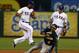 ARLINGTON, TX - JUNE 17: Elvis Andrus #1 of the Texas Rangers (L) tags out Coco Crisp #4 of the Oakland Athletics at second base as Ian Kinsler #5 of the Texas Rangers (R) looks on to end the top of the fourth inning at Rangers Ballpark in Arlington on June 17, 2013 in Arlington, Texas. (Photo by Tom Pennington/Getty Images)