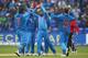 CARDIFF, WALES - JUNE 20: Ravindra Jadeja (C) of India celebrates with his captain MS Dhoni (L) after taking the wicket of Mahela Jayawardena of Sri Lanka during the ICC Champions Trophy Semi-Final match between India and Sri Lanka at the SWALEC Stadium on June 20, 2013 in Cardiff, Wales. (Photo by Michael Steele/Getty Images)