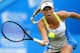 EASTBOURNE, ENGLAND - JUNE 20: Caroline Wozniacki of Denmark in action against Ekaterina Makarova of Russia during day six of the AEGON International tennis tournament at Devonshire Park on June 20, 2013 in Eastbourne, England. (Photo by Jan Kruger/Getty Images)