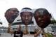 Jun 20, 2013; Miami, FL, USA; Miami Heat fans hold posters of Miami Heat center Chris Bosh, LeBron James and Dwyane Wade prior to the start of game seven in the 2013 NBA Finals at American Airlines Arena. Mandatory Credit: Derick E. Hingle-USA TODAY Sports