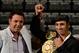 LAS VEGAS, NV - MAY 05: President of Golden Boy Promotions Oscar De La Hoya holds up the arm of boxer Paulie Malignaggi during a news conference after the Floyd Mayweather Jr. and Miguel Cotto fight at the MGM Grand Garden Arena on May 5, 2012 in Las Vegas, Nevada. Malignaggi defeated WBA welterweight champion Vyacheslav Senchenko in the Ukraine on April 29, 2012 to win the WBA welterweight belt. (Photo by Ethan Miller/Getty Images)