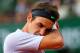 PARIS, FRANCE - JUNE 02: Roger Federer of Switzerland wipes his face in his Men's Singles match against Gilles Simon of France during day eight of the French Open at Roland Garros on June 2, 2013 in Paris, France. (Photo by Julian Finney/Getty Images)