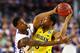 ARLINGTON, TX - MARCH 29: Ben McLemore #23 of the Kansas Jayhawks defends against Trey Burke #3 of the Michigan Wolverines in the first half during the South Regional Semifinal round of the 2013 NCAA Men's Basketball Tournament at Dallas Cowboys Stadium on March 29, 2013 in Arlington, Texas. (Photo by Tom Pennington/Getty Images)